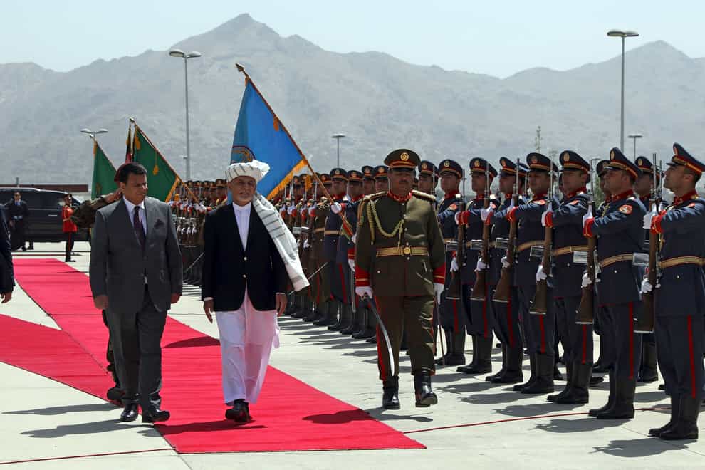 President Ashraf Ghani inspecting troops earlier this month (Rahmat Gul/AP)