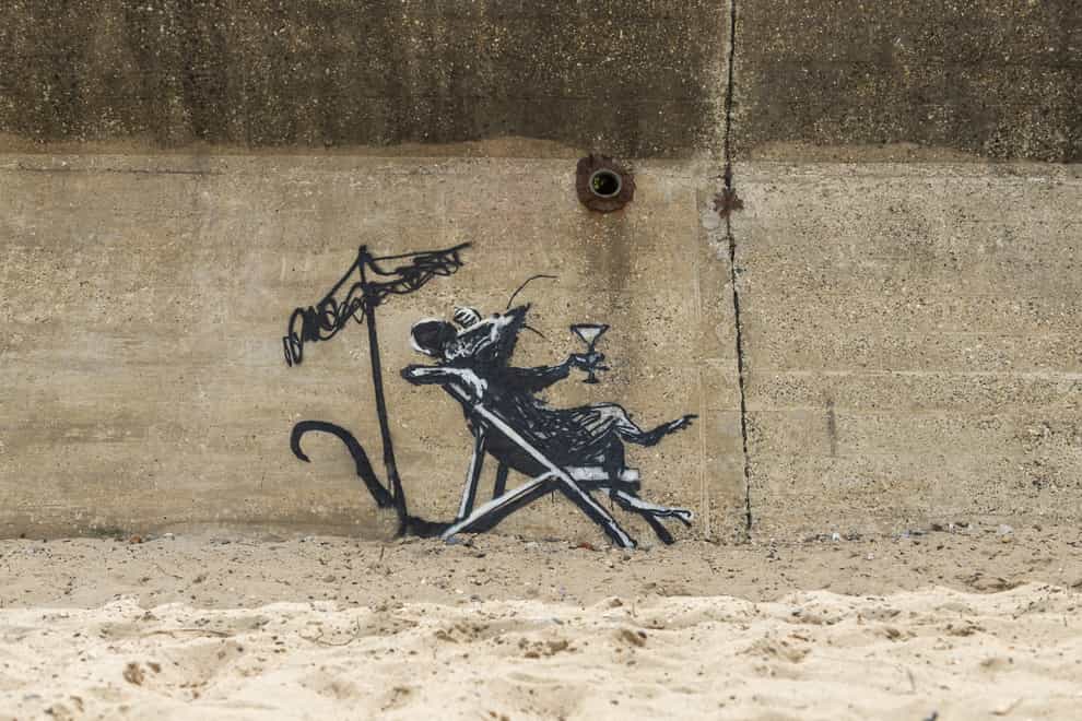 The new work by Banksy on a beach wall in Lowestoft, before it was defaced (Banksy/PA)