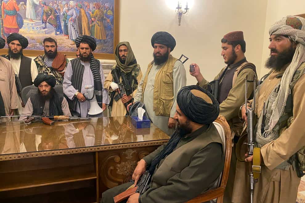 Taliban fighters in the Afghan presidential palace (Zabi Karimi/AP)