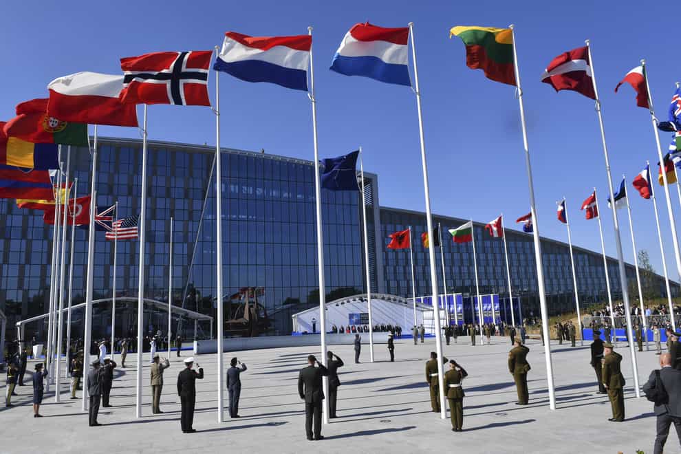 Flags of Nato member countries flutter during a summit in Brussels (Geert Vanden Wijngaert/AP)