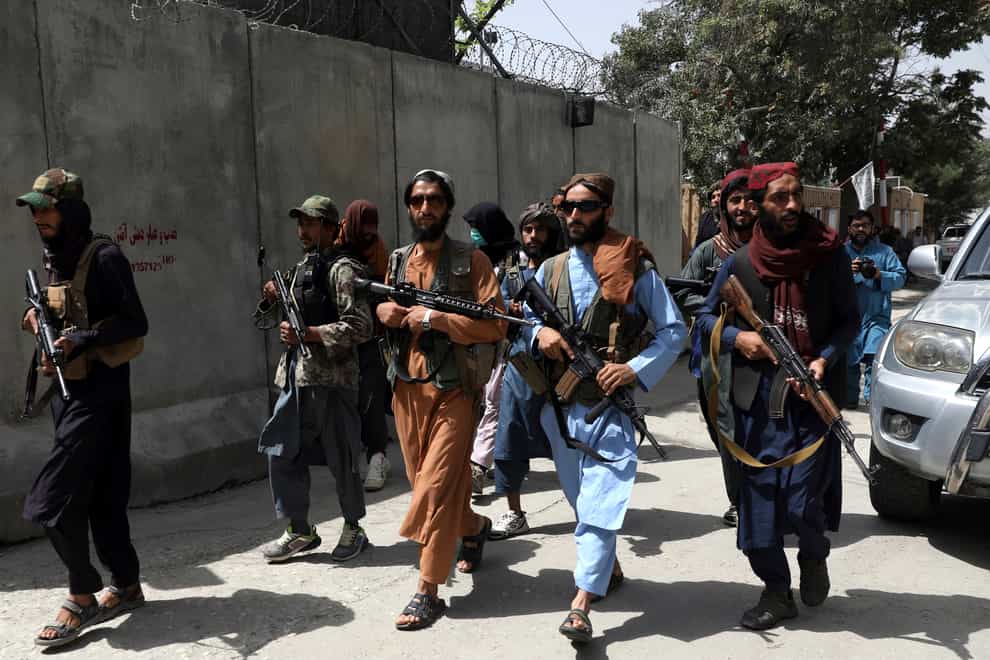 Taliban fighters patrol in Wazir Akbar Khan neighbourhood in the city of Kabul, Afghanistan (Rahmat Gul/AP)