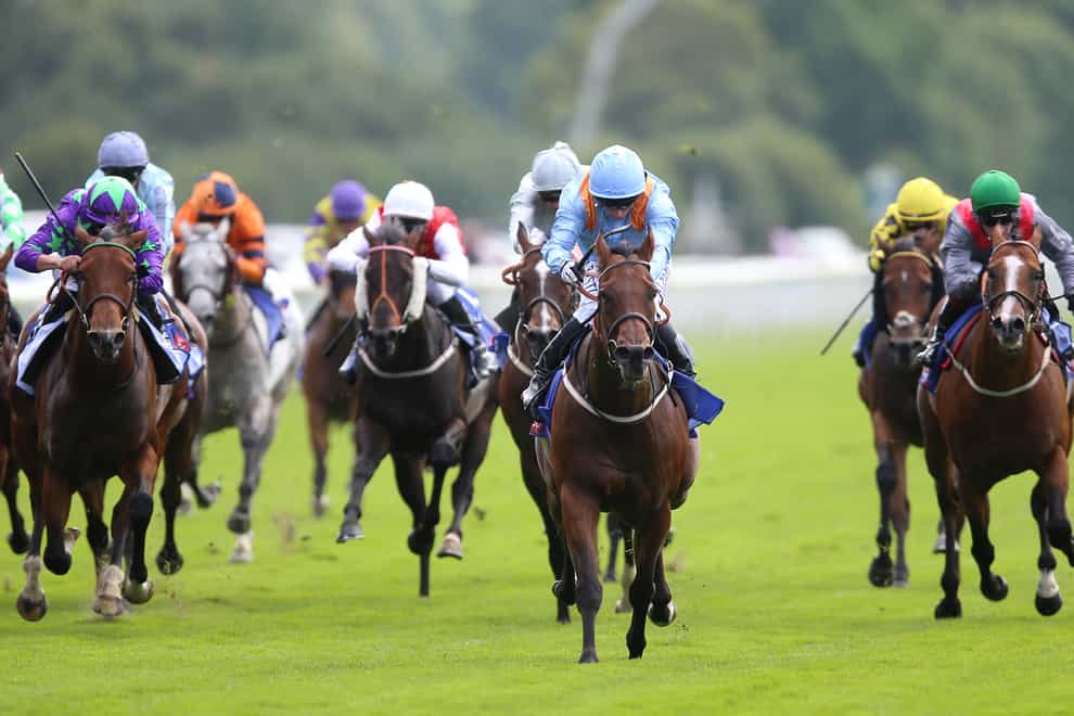 Copper Knight and David Allan (centre, blue) gallop to victory in the Sky Bet And Symphony Group Handicap at York (Nigel French/PA)