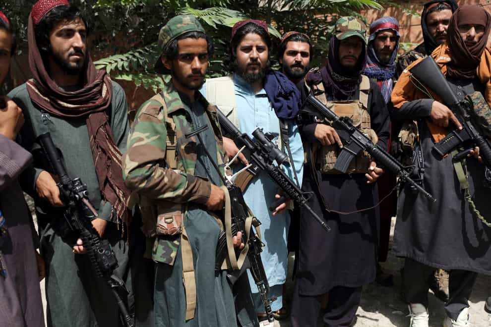 Taliban fighters pose for photograph in Wazir Akbar Khan in the city of Kabul, Afghanistan (Rahmat Gul/AP)
