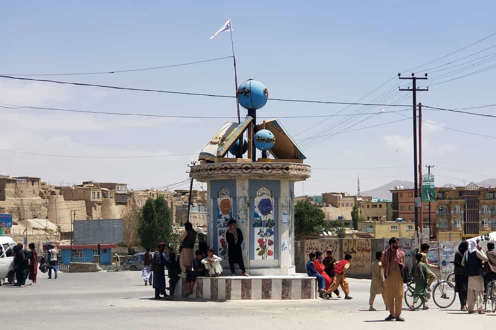A Taliban flag flies at a square in the city of Ghazni, Afghanistan (Gulabuddin Amiri/AP)