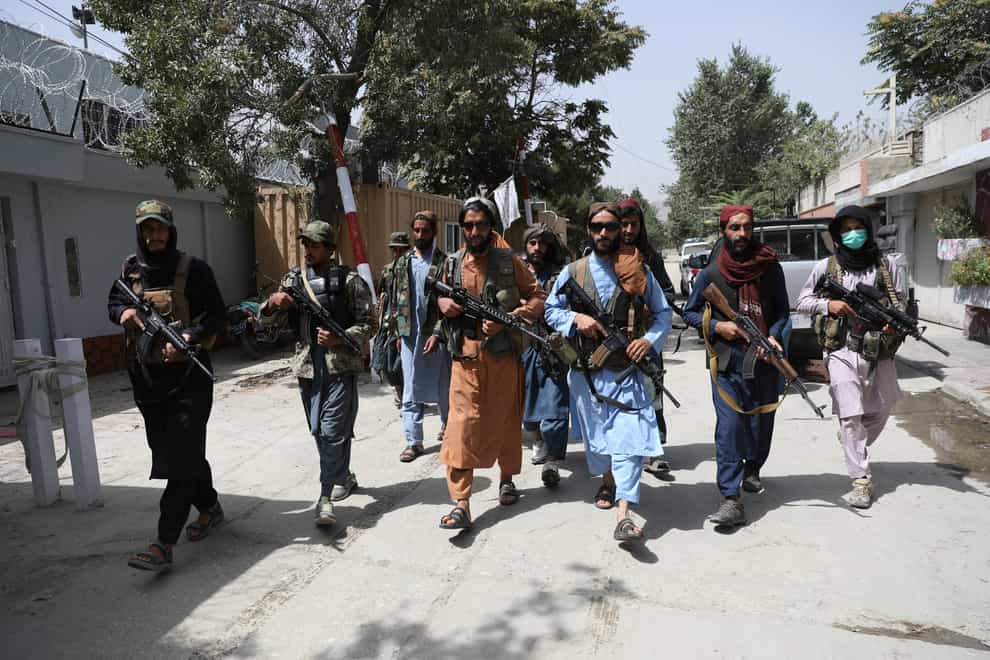 Taliban fighters patrol in the Wazir Akbar Khan neighbourhood in the city of Kabul, Afghanistan (Rahmat Gul/AP)