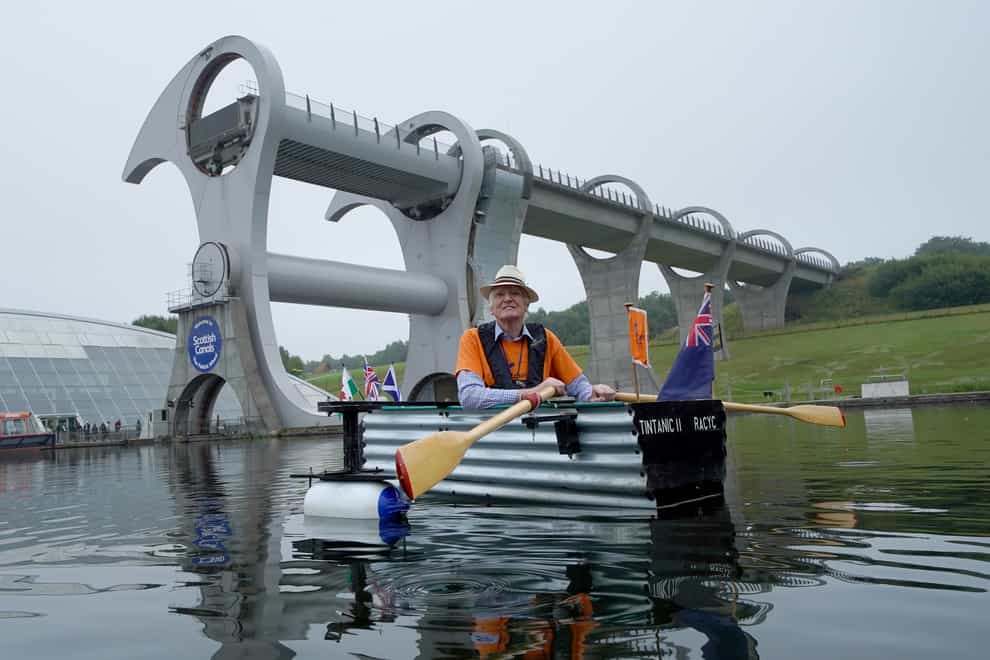 Michael Stanley, known as ‘Major Mick’, with his home-made boat ‘Tintanic II’ at the Falkirk Wheel (Andrew Milligan/PA)