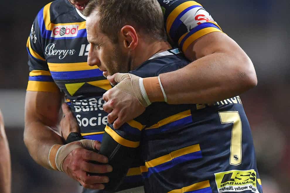Kevin Sinfield (left) and Rob Burrow embrace after the match at Headingley (Dave Howarth/PA).