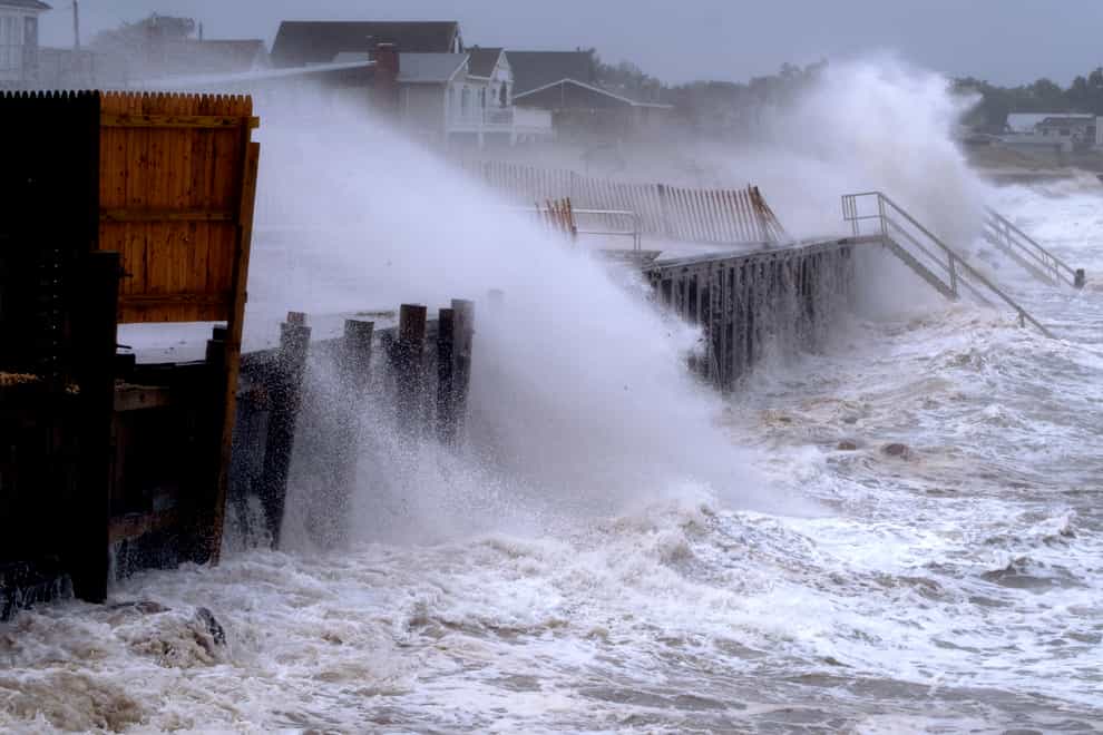 Waves pound a seawall in Montauk, New York as Tropical Storm Henri affects the Atlantic coast (Craig Ruttle/AP)