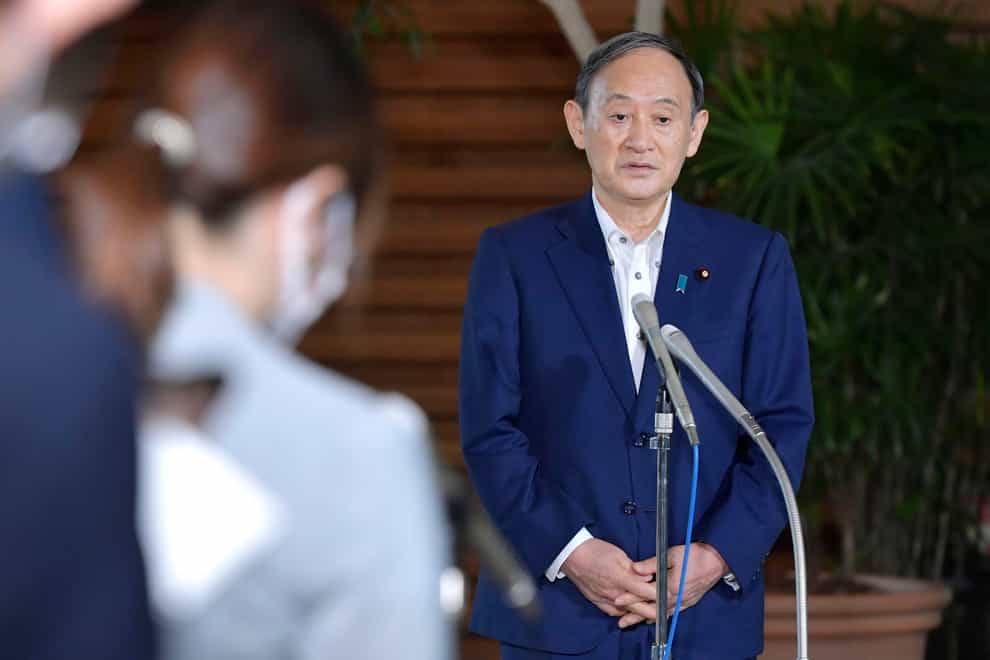 Japanese prime minister Yoshihide Suga answers reporters’ questions (Yoshitaka Sugawara/AP)