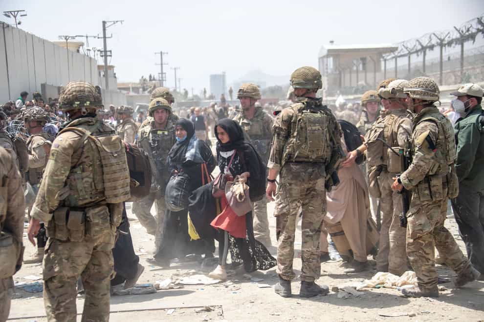 Members of the British and US military engaged in the evacuation of people out of Kabul (Mo/PA)