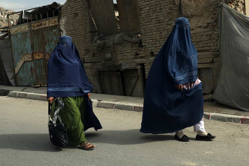 Afghan women in burqas walk on a street in Kabul, Afghanistan, Sunday (Rahmat Gul/AP)