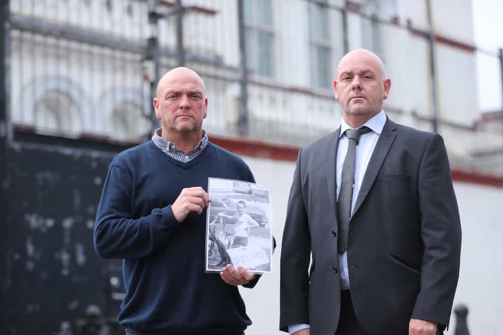 Joe (left) and Kieran Geddis hold a picture of their brother Stephen, who died aged 10, in 1975, outside Banbridge Court House where a fresh inquest is being held (Niall Carson/PA)