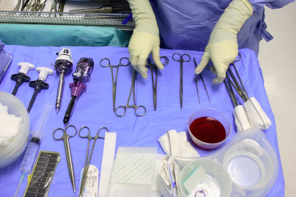 A member of staff checks instruments ahead of surgery (Chris Ison/PA)