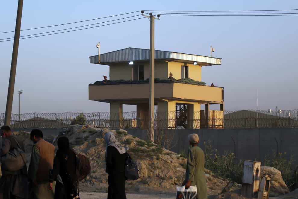 US soldiers stand guard at the airport tower near an evacuation control checkpoint during ongoing evacuations at Hamid Karzai International Airport, in Kabul, Afghanistan (AP)