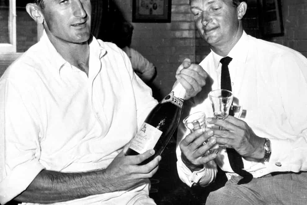 Ted Dexter, left, shares a drink with Australia captain Richie Benaud after an Ashes Test in 1963 (PA)