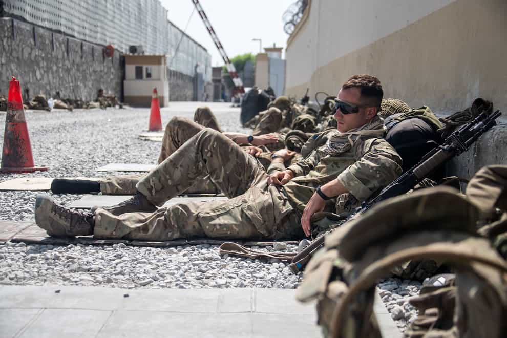 A member of the UK Armed Forces, who continue to take part in the evacuation of entitled personnel, taking a rest at Kabul airport (LPhot Ben Shread/MoD/PA)
