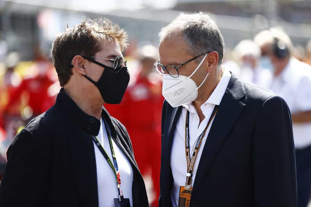 F1 boss Stefano Domenicali speaks to Tom Cruise ahead of the British Grand Prix (POOL Via FIA)