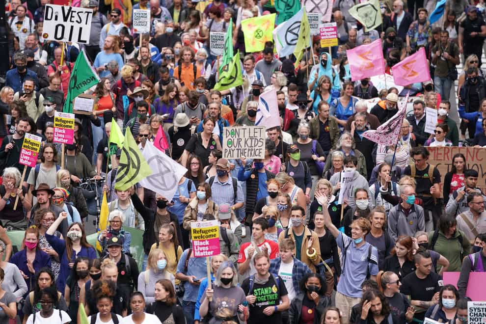 Supporters of Extinction Rebellion march along St Martin’s Le Grand in the City of London (Kirsty O’Connor/PA)