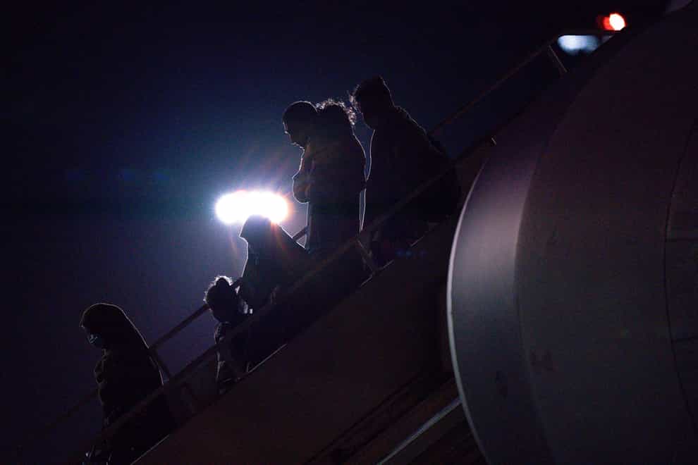 Afghan evacuees depart a flight from Afghanistan (Jacob King/PA)