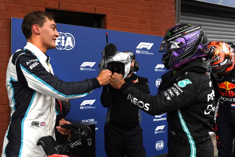 George Russell fist bumps with Lewis Hamilton after finishing second in qualifying for the Belgian Grand Prix (John Thys/AP).