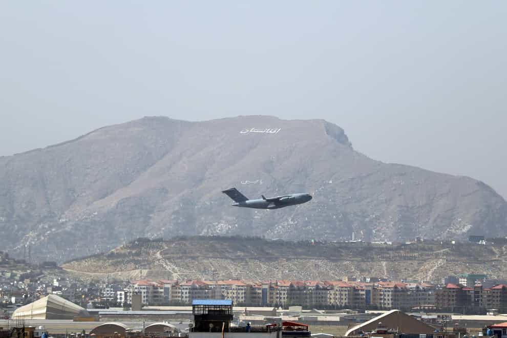 US military aircraft takes off at the Hamid Karzai International Airport in Kabul, Afghanistan (Wali Sabawoon/AP)