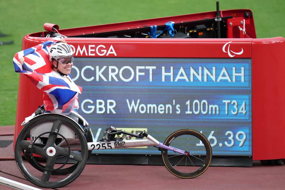Great Britain’s Hannah Cockroft poses with the scoreboard showing her new world record time (Tim Goode/PA)