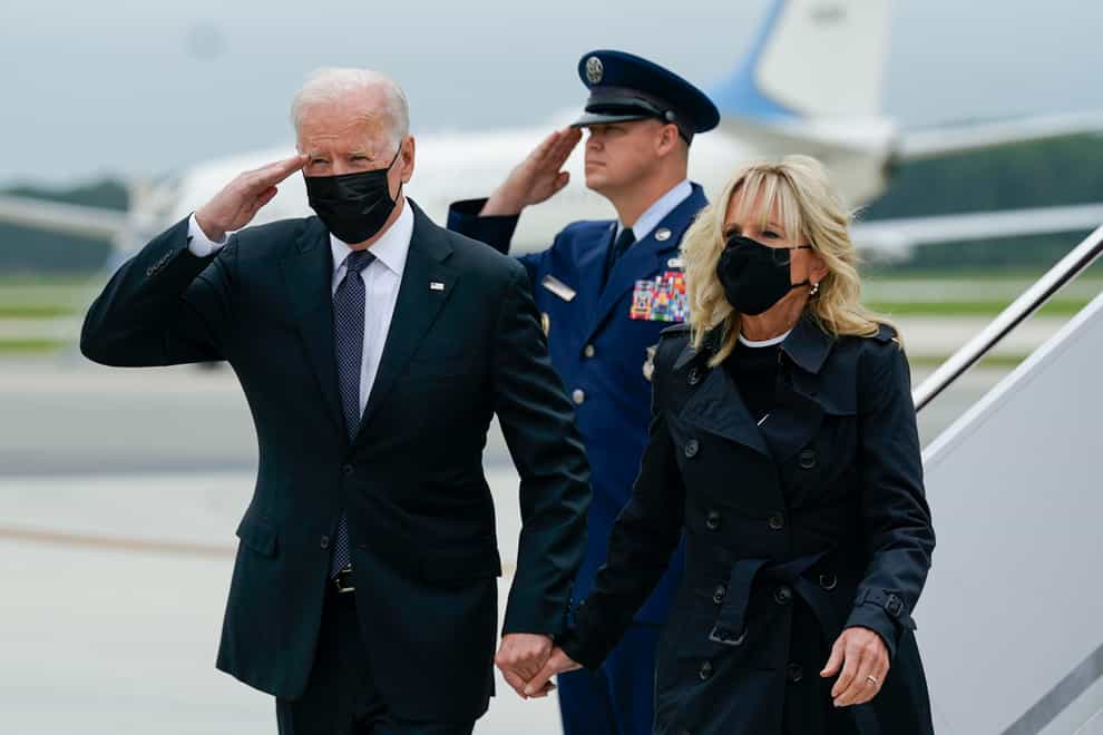 President Joe Biden returns a salute (Manuel Balce Ceneta/AP)