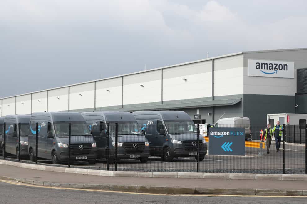 Electric delivery vans at the Amazon warehouse in the Titanic Quarter, Belfas (Niall Carson/PA)