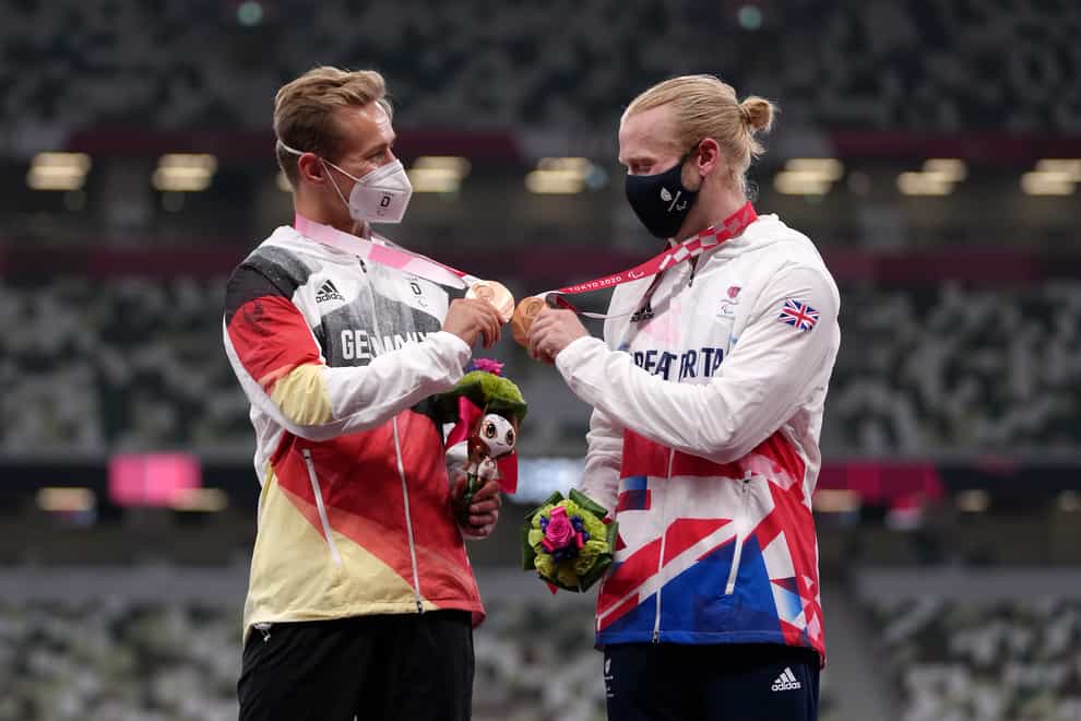 Great Britain’s Jonnie Peacock, right, and Germany’s Johannes Floors sensationally shared 100m bronze (Tim Goode/PA)