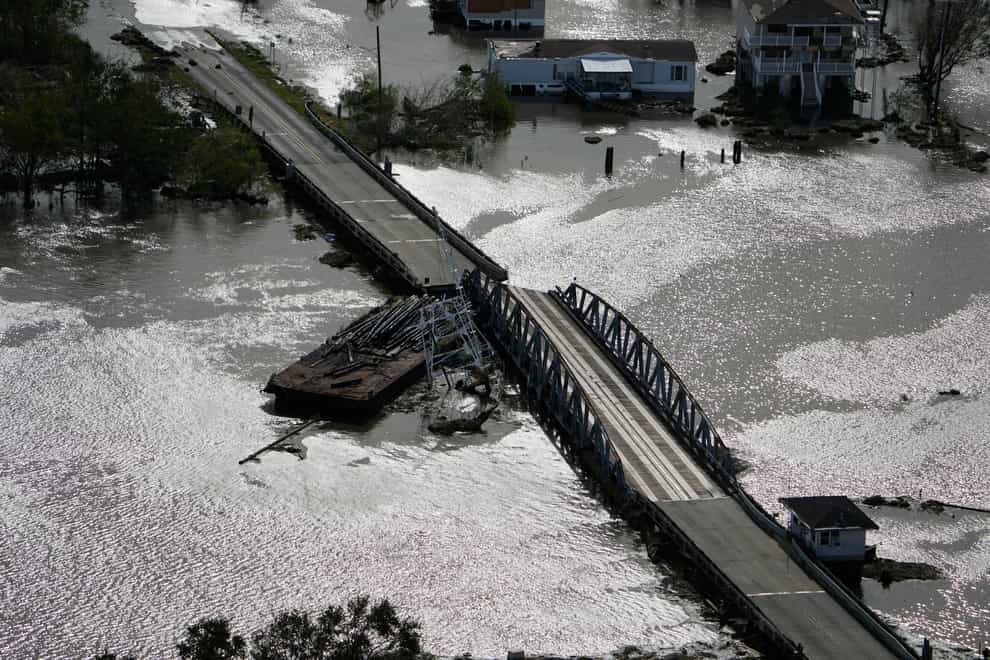 A barge damages a bridge that divides Lafitte, Louisiana, and Jean Lafitte, in the aftermath of Hurricane Ida (David J Phillip/AP)