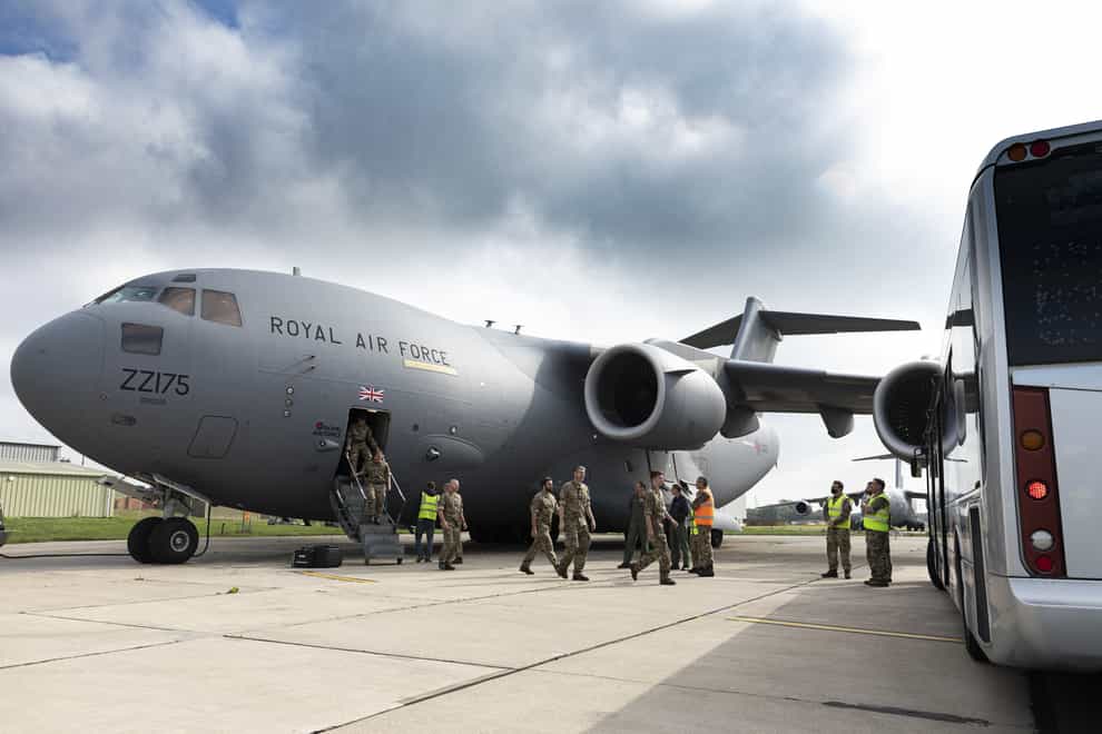 UK military personnel departing from a RAF C-17 aircraft at RAF Brize Norton, Oxfordshire (Ministry of Defence/PA)