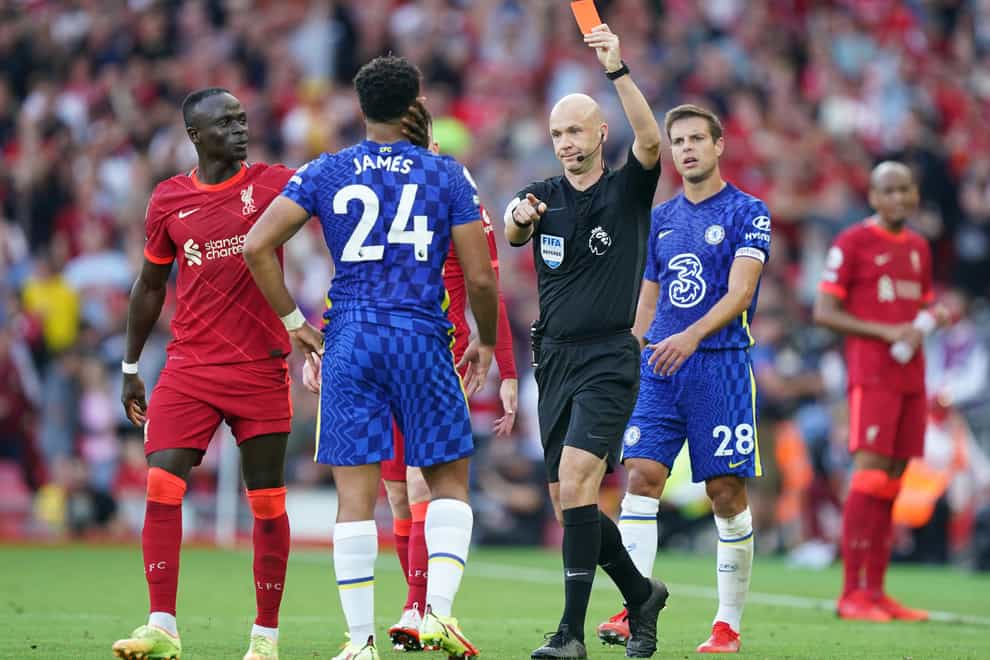 Reece James, left, is sent off by referee Anthony Taylor in Chelsea’s 1-1 Premier League draw with Liverpool at Anfield (Mike Egerton/PA)