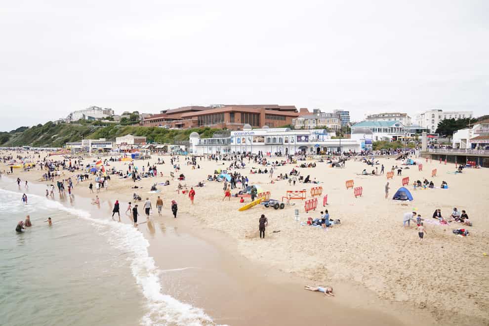 People enjoying the Bank Holiday weather on Bournemouth beach. Picture date: Monday August 30, 2021.