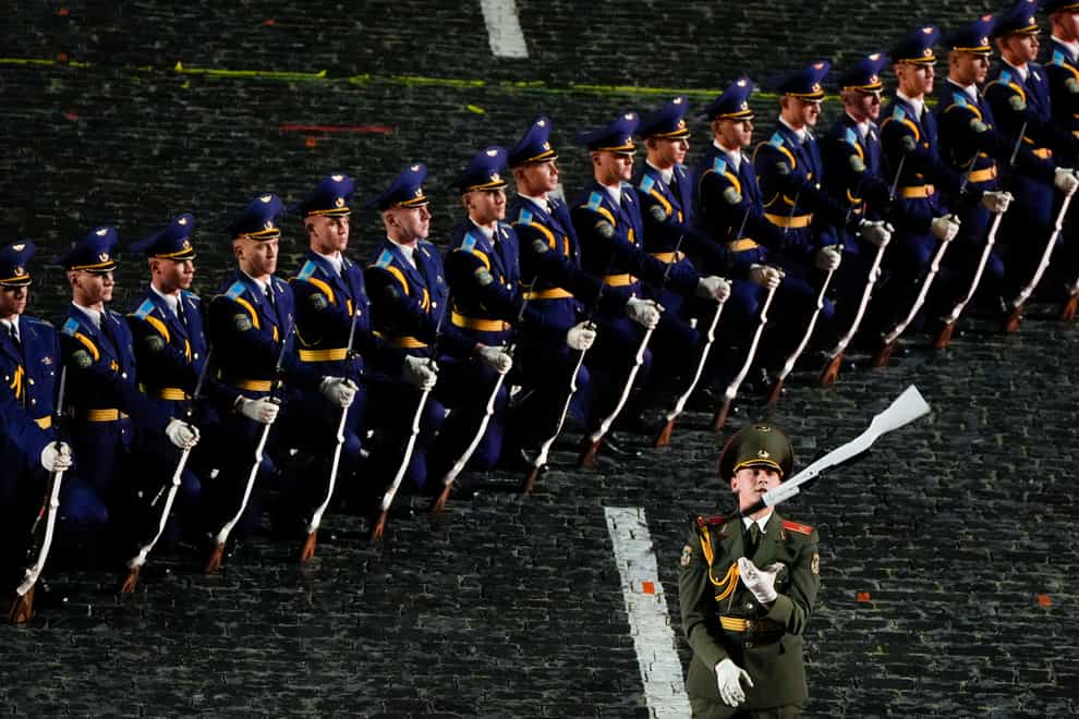 Soldiers of Belarus’ military band perform during the Spasskaya Tower International Military Music Festival in Red Square in Moscow (Alexander Zemlianichenko/AP)