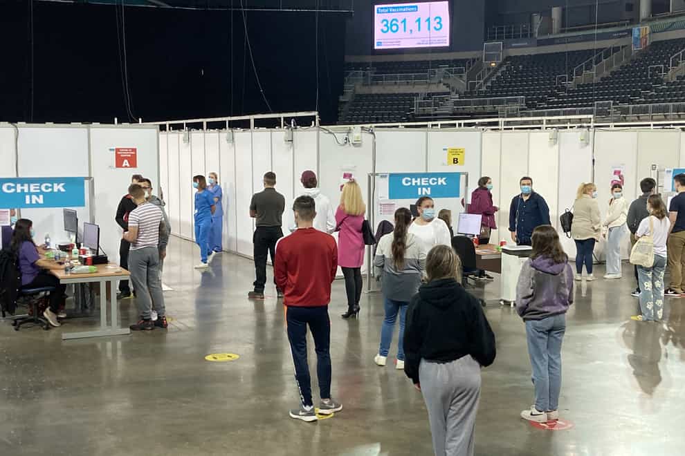 Queues for Covid-19 vaccines at the SSE Arena in Belfast (Rebecca Black/PA)