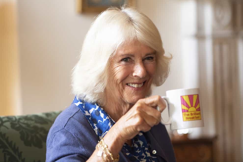 The Duchess of Cornwall takes a drink during a meeting with young women (Eddie Mulholland/Daily Telegraph)