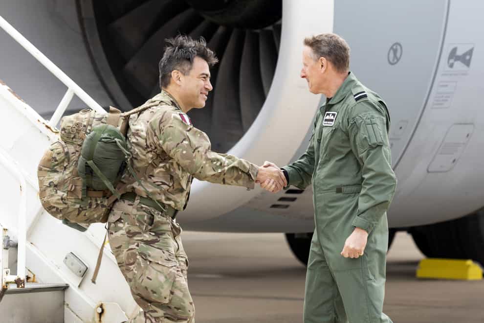 Commander of 16 Air Assault Brigade Brigadier James Martin (left), being greeted by Air Mobility Force Commander Air Commodore David Manning at RAF Brize Norton, Oxfordshire. on his return from Afghanistan (SAC Samantha Holden RAF/Ministry of Defence/Crown Copyright/PA)