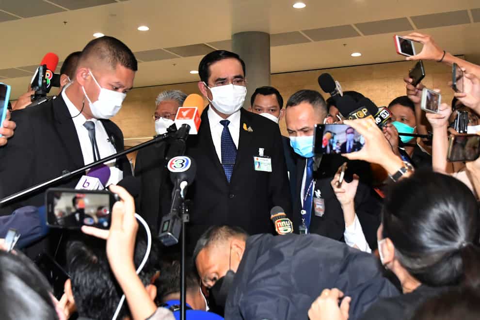 Thailand’s prime minister Prayuth Chan-ocha talks to reporters at parliament (AP)