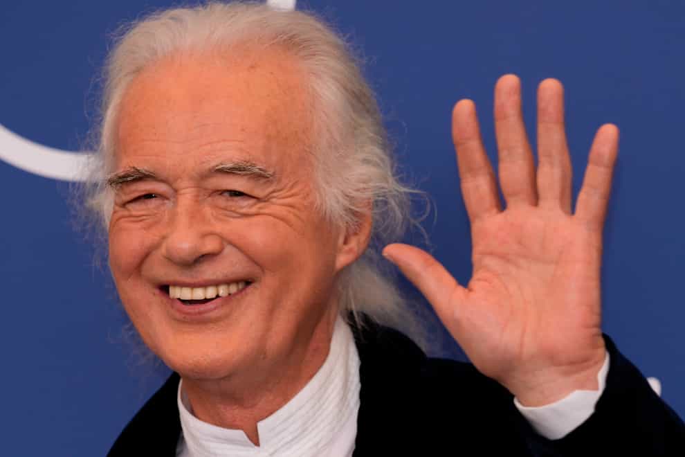 Musician Jimmy Page poses at the photo call of the movie ‘Becoming Led Zeppelin’ at the 78th edition of the Venice Film Festival at the Venice Lido, Italy, Saturday, Sep. 4, 2021. The festival is on Sept. 1 through Sept. 11. (AP Photo/Domenico Stinellis)