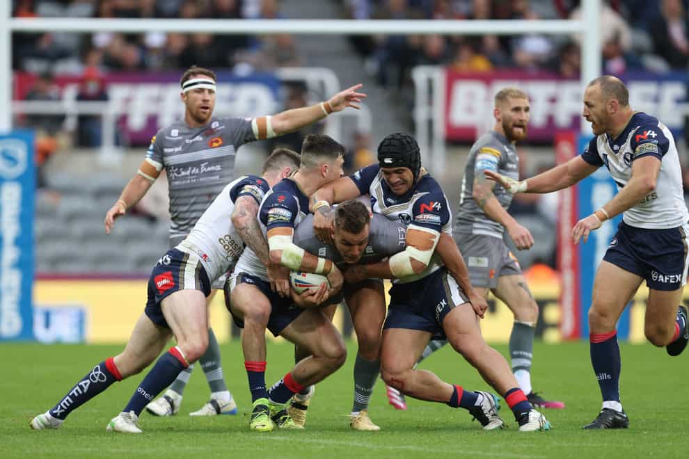 Catalans Dragons’ Josh Drinkwater is tackled during the Magic Weekend game with St Helens (Richard Sellers/PA)