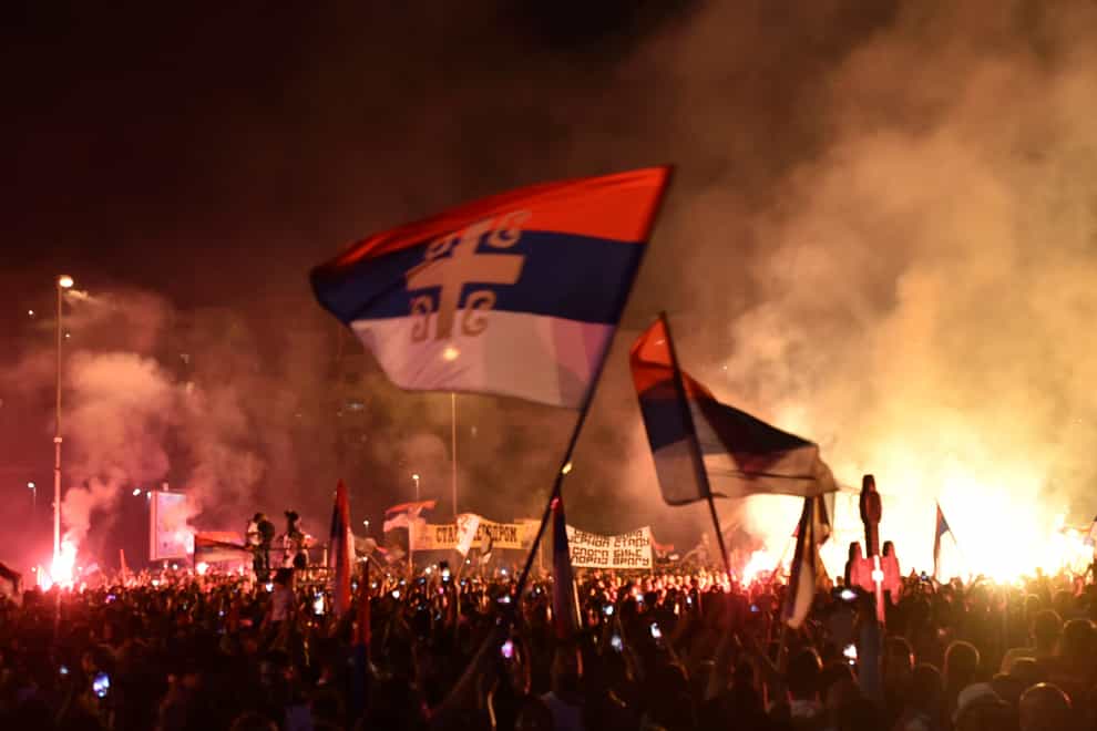 Hundreds of protesters confronted police in Cetinje ahead of the inauguration of Mitropolitan Joanikije as head of the Serbian Orthodox Church in Montenegro (Risto Bozovic/AP)