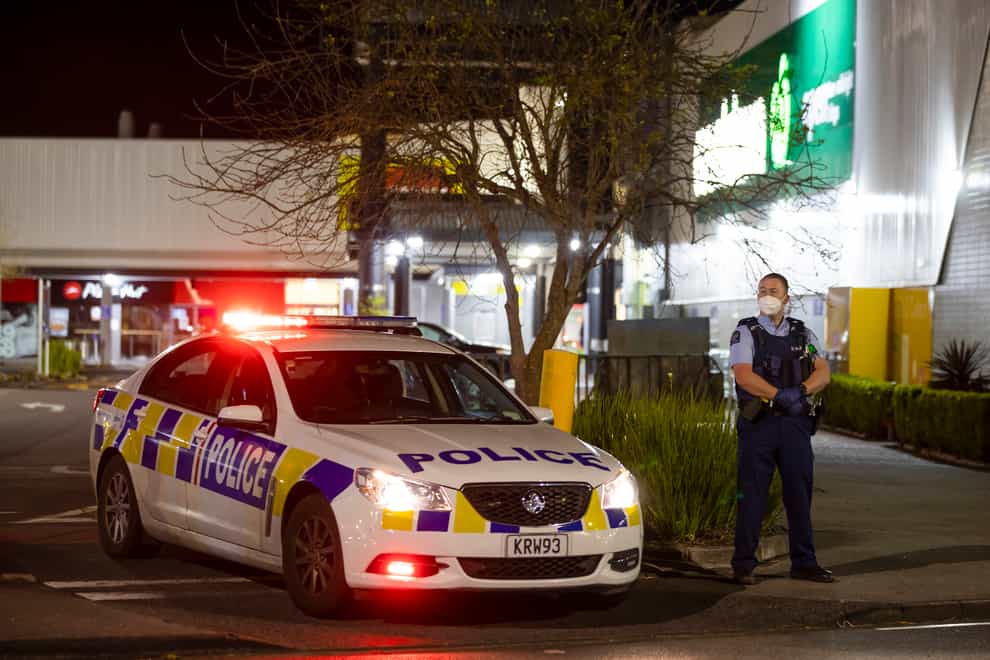 Police outside the supermarket in Auckland, New Zealand, where a violent extremist stabbed seven shoppers (Brett Phibbs/AP)