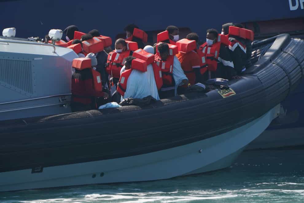 A group of people thought to be migrants are brought in to Dover ((Jonathan Brady/PA)