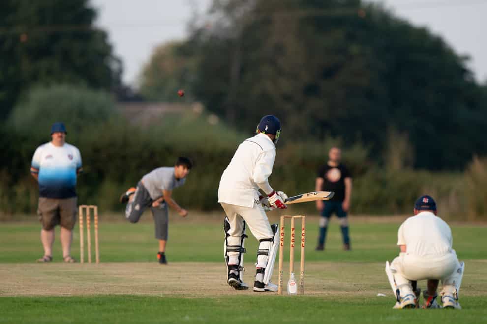 Recently arrived Afghans take part in a match with members of Newport Pagnell Town Cricket Club in Buckinghamshire (Joe Giddens/PA)