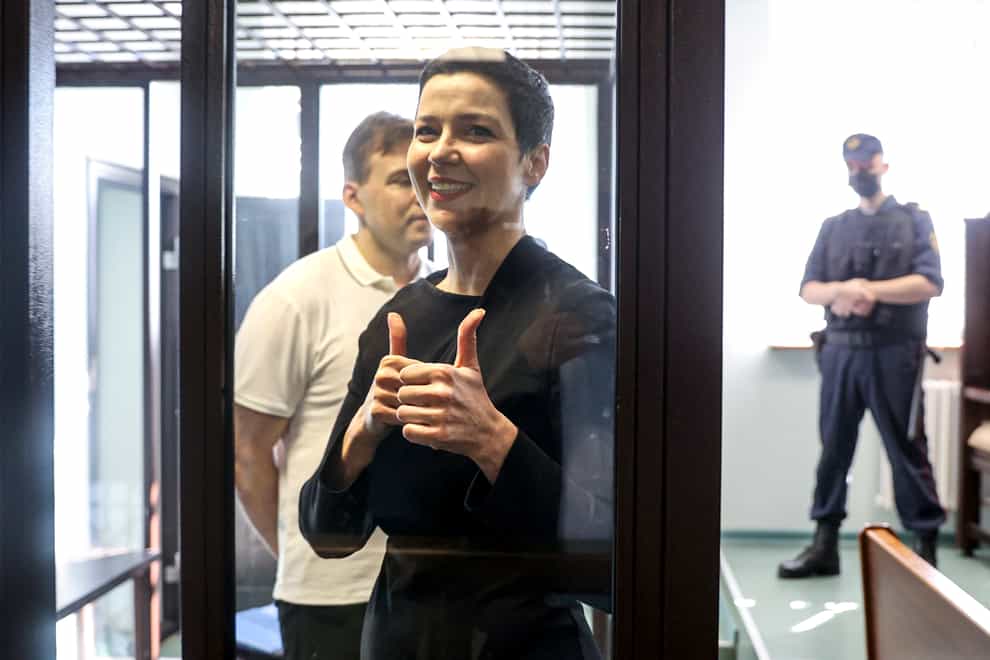 Belarus’ opposition activists Maria Kolesnikova, foreground, and Maxim Znak, behind her at a court appearance in August (Ramil Nasibulin/BelTA pool photo via AP, File)