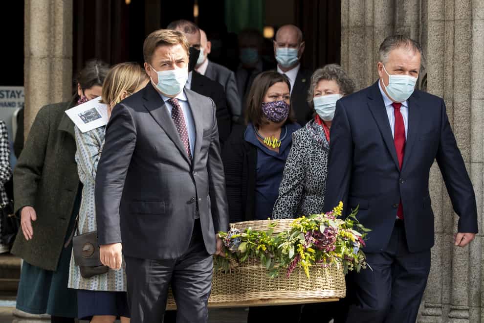 John Hume Jnr (left) and his brother Aidan (right) carry the coffin of their mother Pat Hume (Liam McBurney/PA)