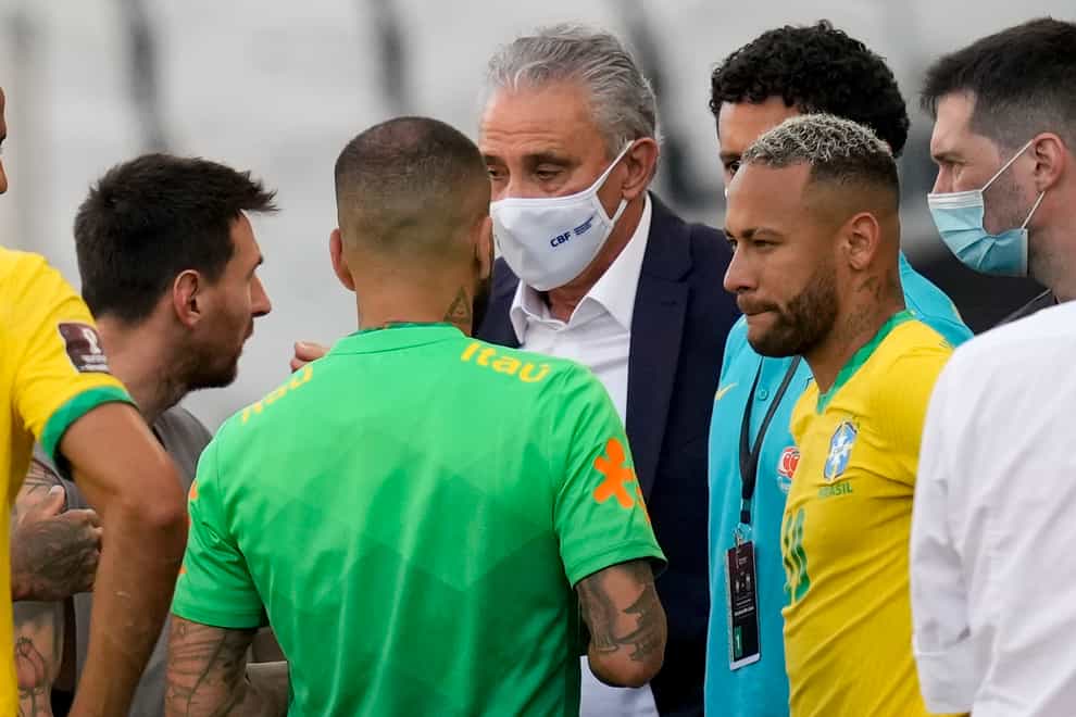 Argentina’s Lionel Messi, left, talks to Brazil’s coach Tite and Neymar during the incident in Sao Paulo (Andre Penner/AP)