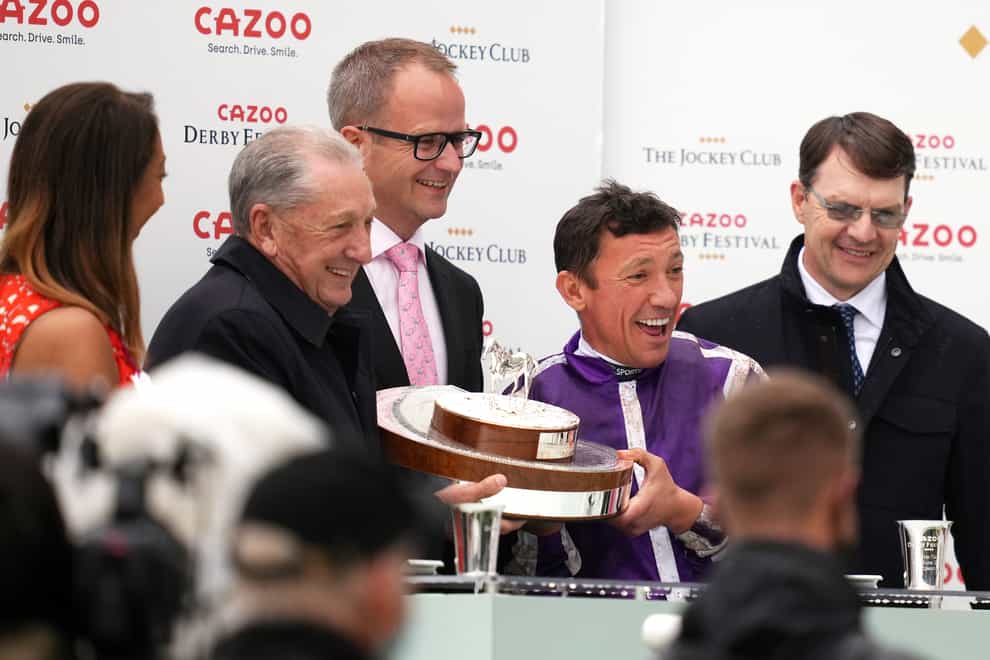Frankie Dettori (second right) with Aidan O’Brien (right) after the victory of Snowfall in the Cazoo Oaks at Epsom (John Walton/PA)