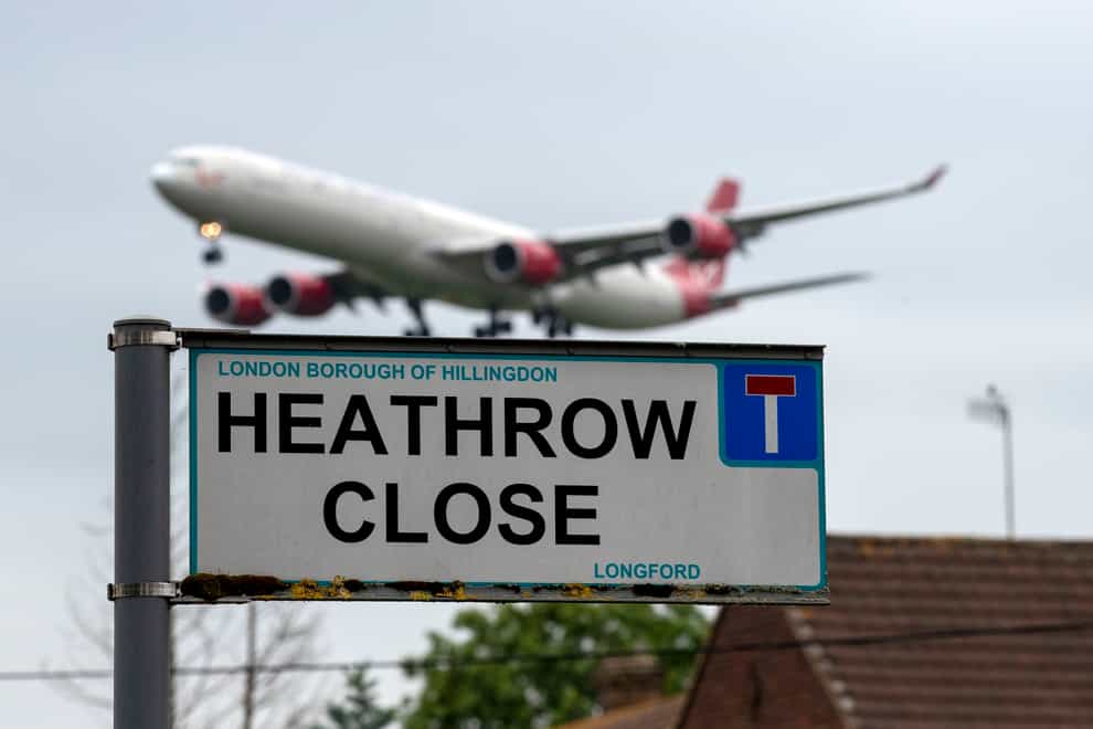 A plane landing at Heathrow Airport (PA)