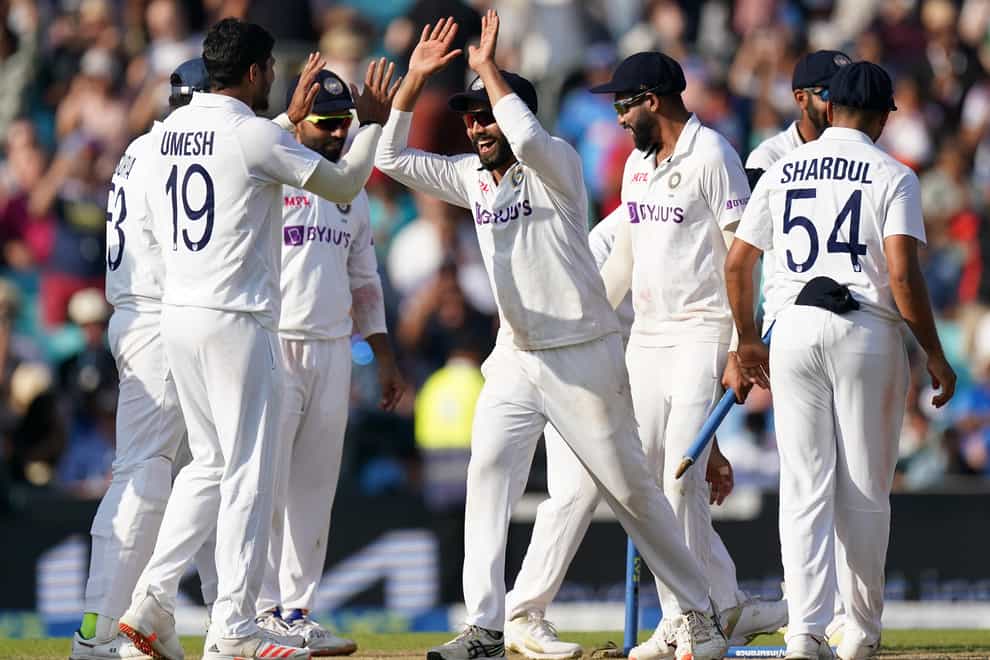 India players celebrate winning the Test (Adam Davy/PA)